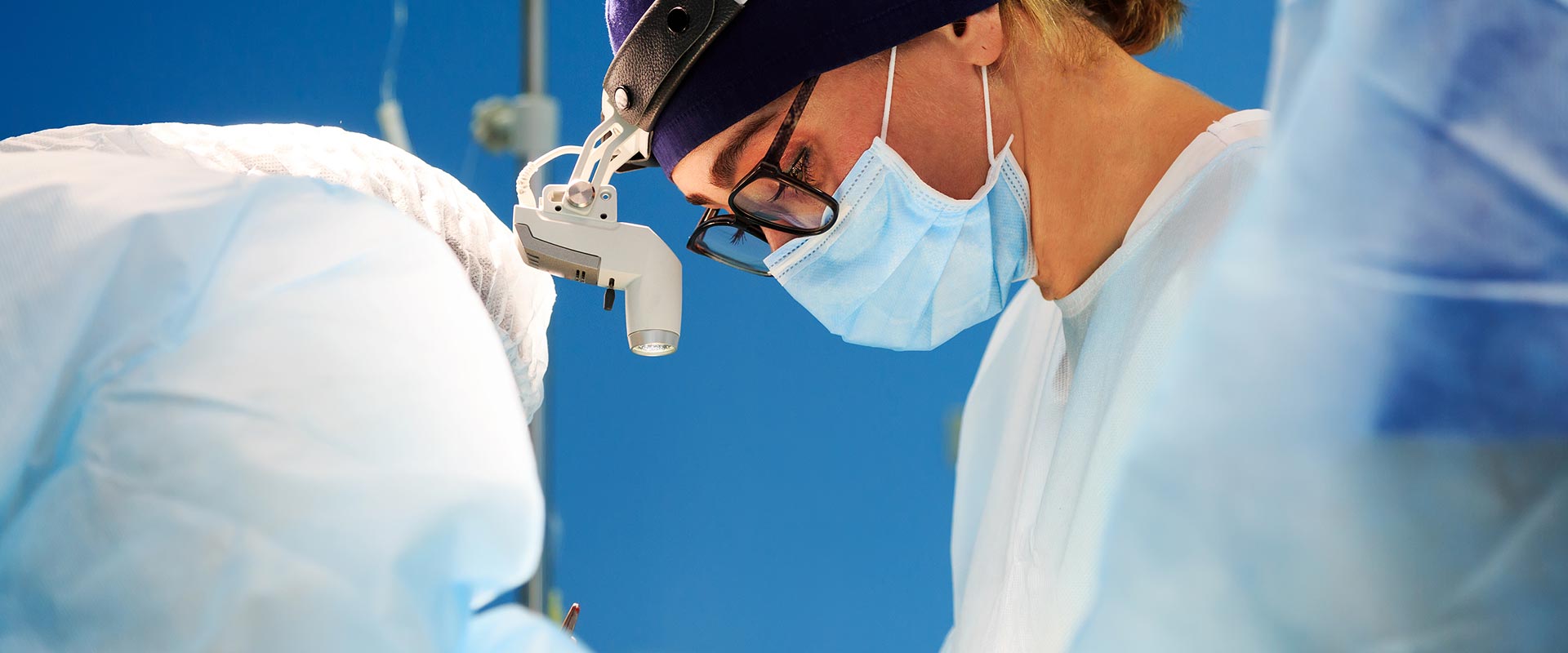 a woman surgeon performing an operation